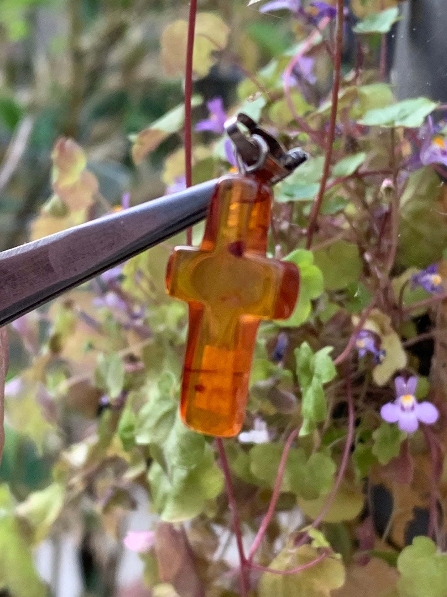 Amber, 'cross' shaped pendant measuring 34x14x5 millimeters, sold with a sliding (adjustable) black leather cord measuring 40 to 70 centimeters!