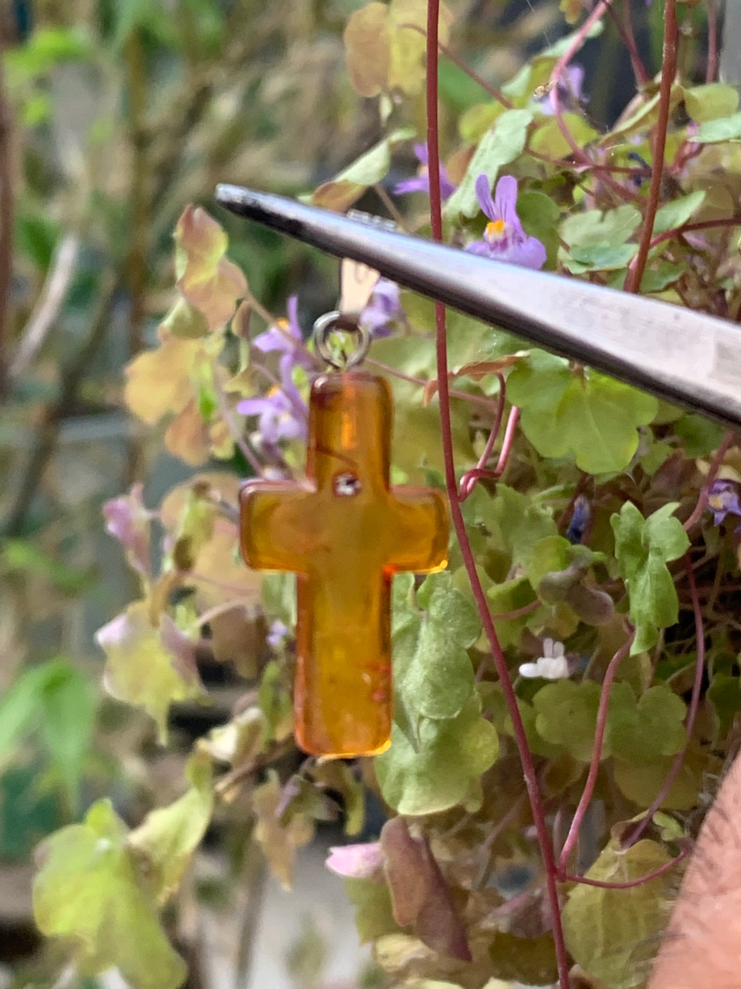 Amber, 'cross' shaped pendant measuring 34x14x5 millimeters, sold with a sliding (adjustable) black leather cord measuring 40 to 70 centimeters!