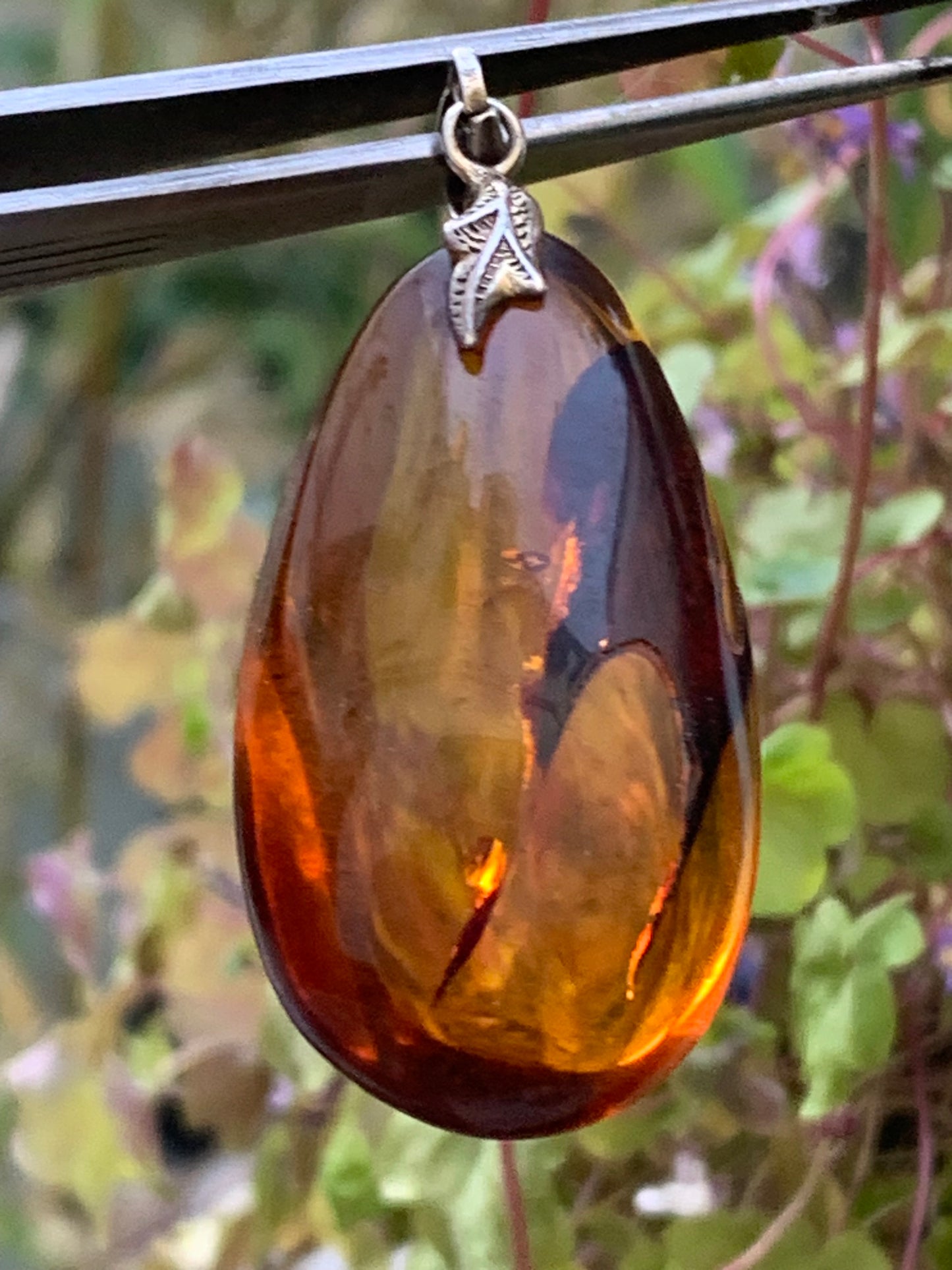 Amber, silver pendant, polished natural pebble measuring 50x22x15 millimeters, sold with a sliding (adjustable) black leather cord measuring 40 to 70 centimeters!