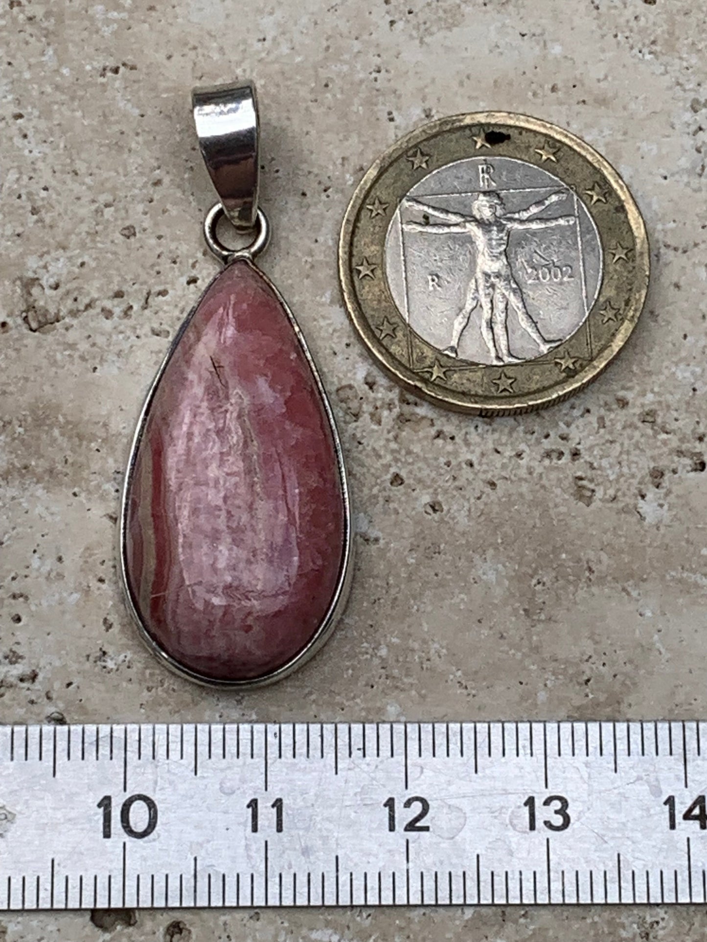 Rhodochrosite! 44mm x17mm x7mm Silver Pendant made by Gem & Zen. Sold with an adjustable black cord!