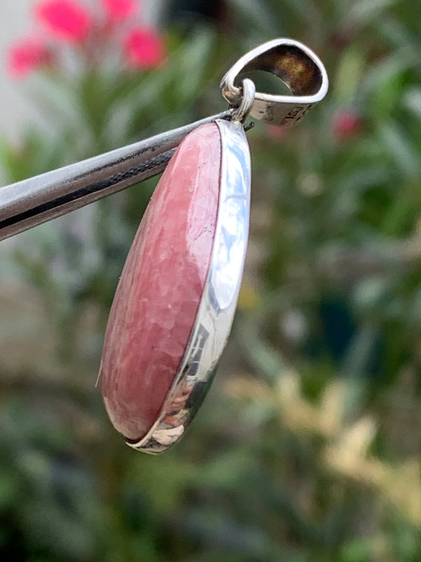 Rhodochrosite! 44mm x17mm x7mm Silver Pendant made by Gem & Zen. Sold with an adjustable black cord!