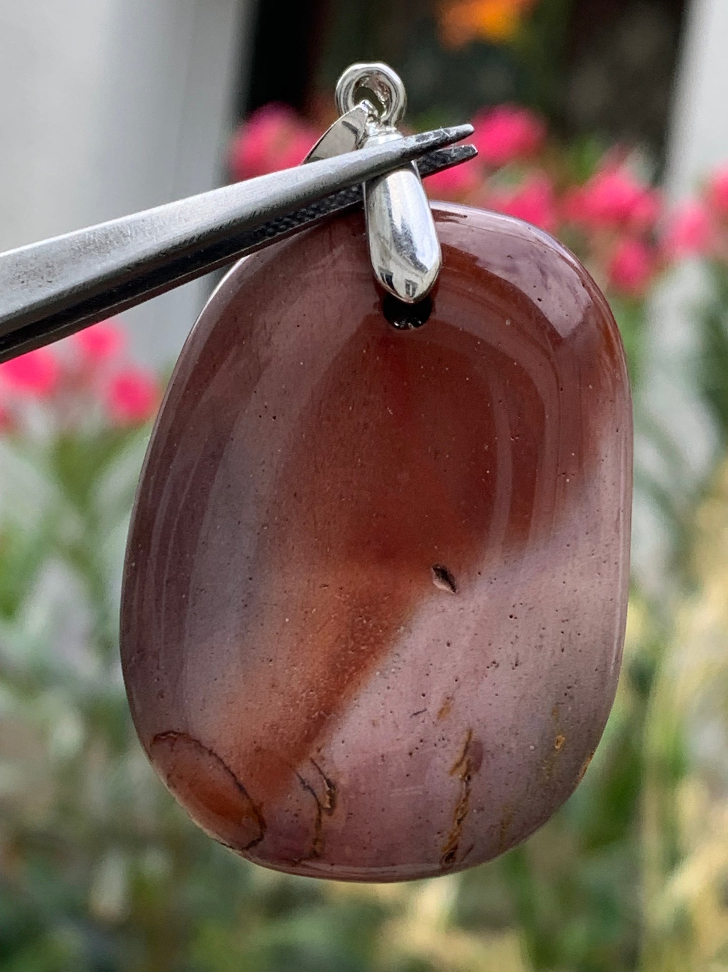 Polychrome jasper, pendant measuring 44mm high x 32mm wide x 10mm deep. Sold with an adjustable black cord!
