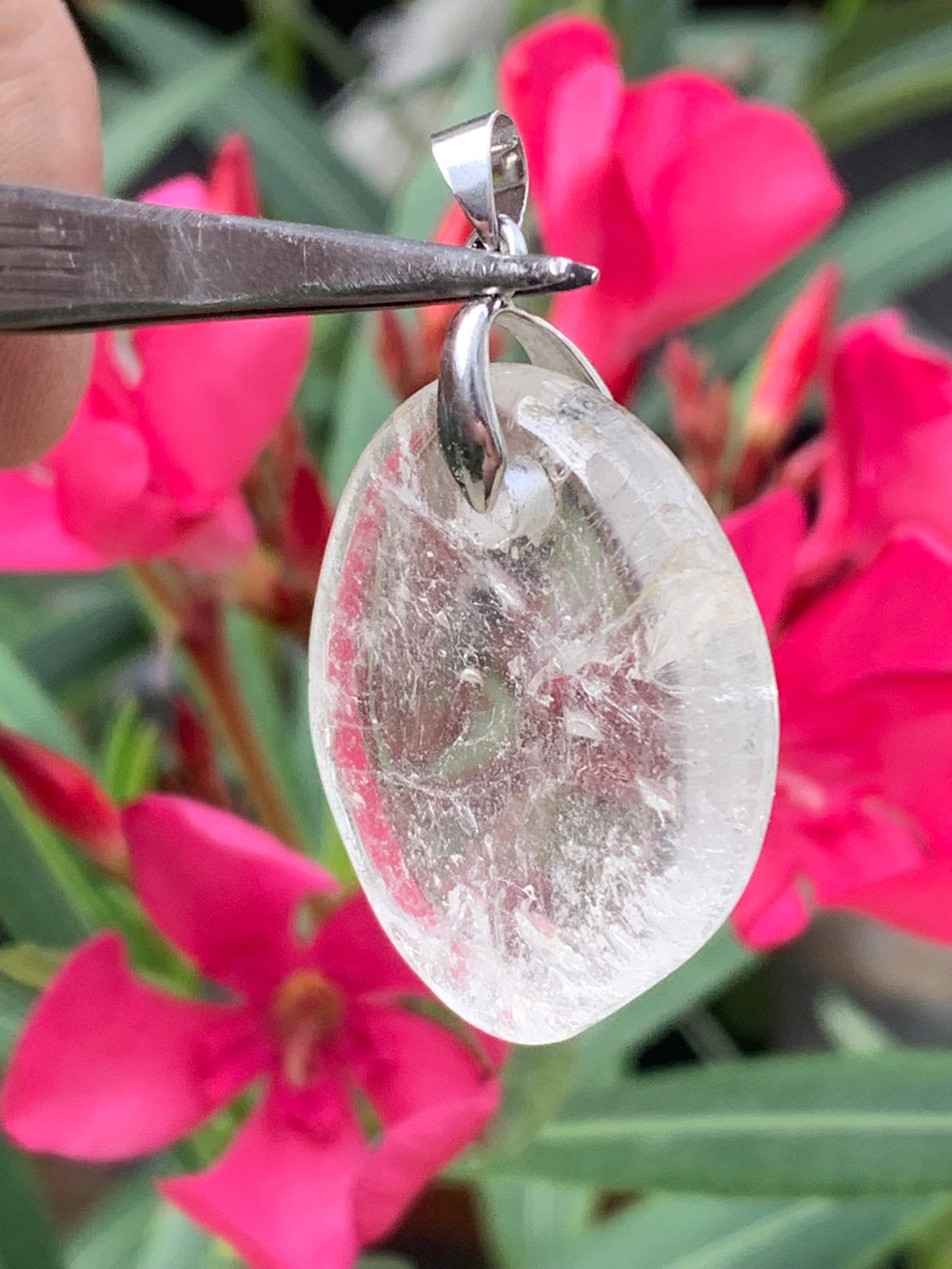 Rock crystal/Quartz, pendant measuring 45mm high x 30mm wide x 7mm thick. Sold with an adjustable black cord!