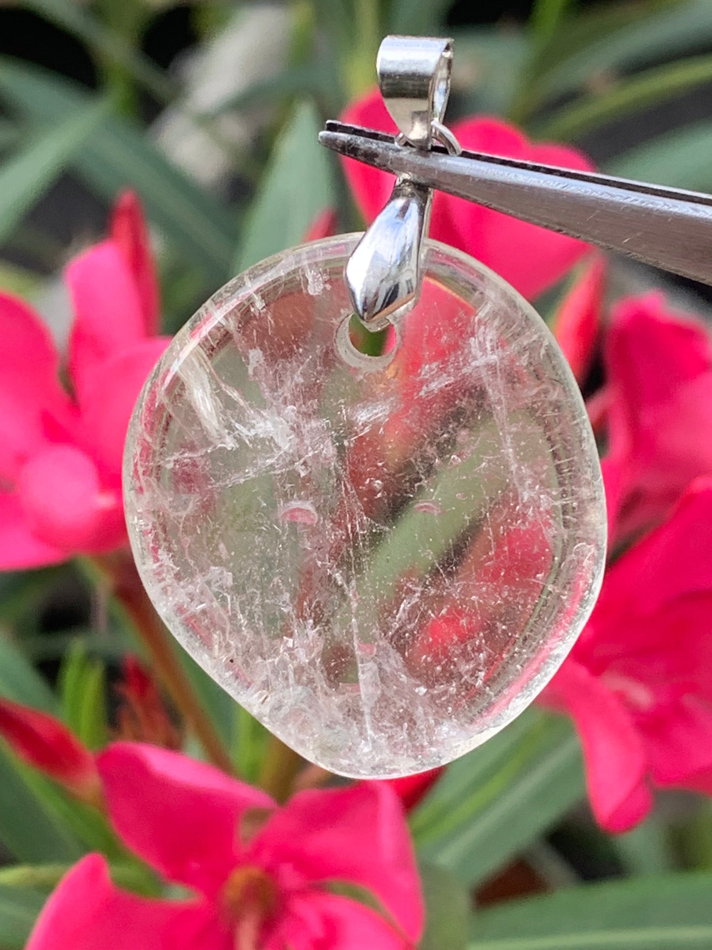 Rock crystal/Quartz, pendant measuring 45mm high x 30mm wide x 7mm thick. Sold with an adjustable black cord!