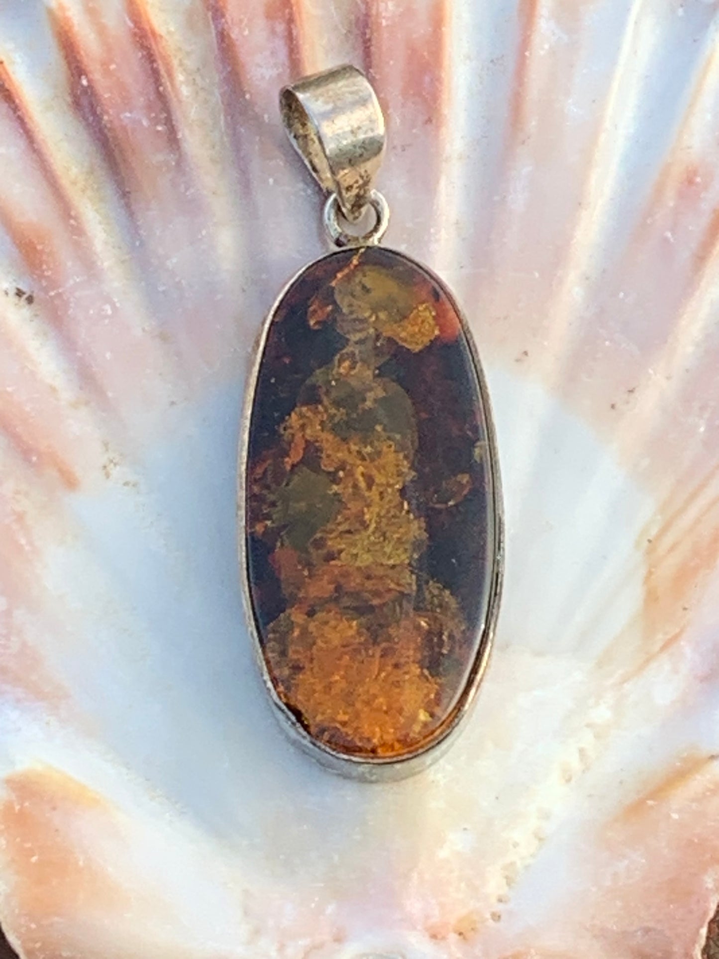 Amber, silver pendant measuring 52 x 18 x 6 mm / 6.3 grams, sold with a sliding black cord measuring 40 to 70 cm!