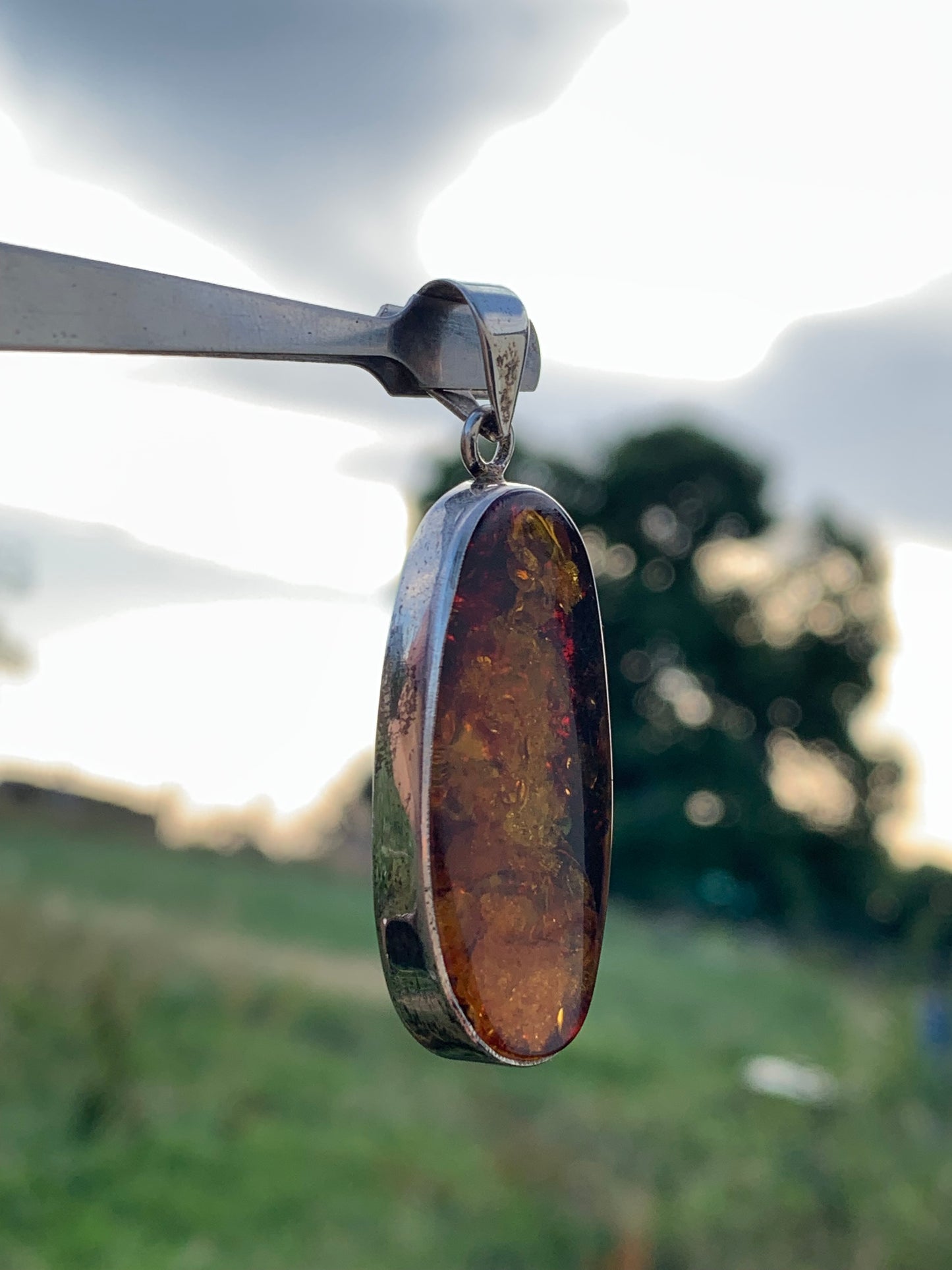 Amber, silver pendant measuring 52 x 18 x 6 mm / 6.3 grams, sold with a sliding black cord measuring 40 to 70 cm!