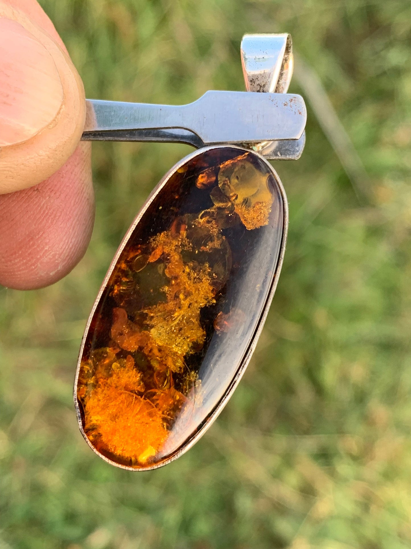 Amber, silver pendant measuring 52 x 18 x 6 mm / 6.3 grams, sold with a sliding black cord measuring 40 to 70 cm!