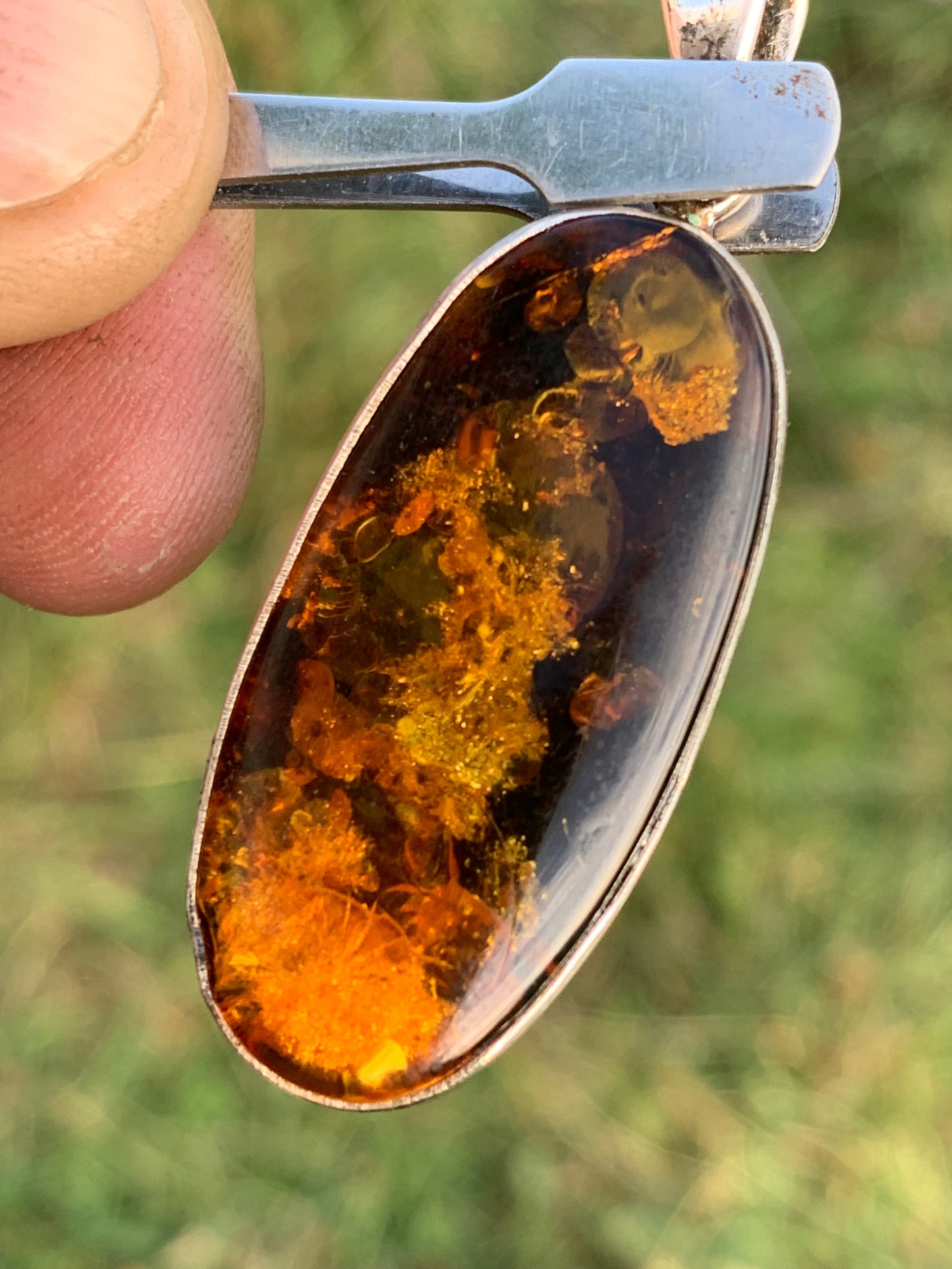 Amber, silver pendant measuring 52 x 18 x 6 mm / 6.3 grams, sold with a sliding black cord measuring 40 to 70 cm!