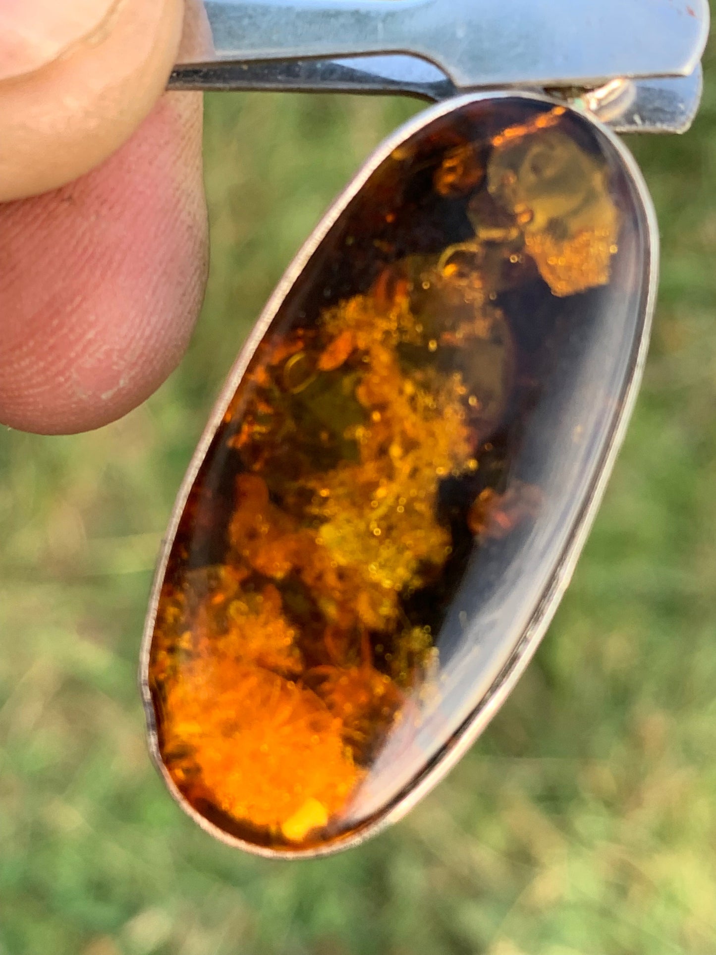 Amber, silver pendant measuring 52 x 18 x 6 mm / 6.3 grams, sold with a sliding black cord measuring 40 to 70 cm!