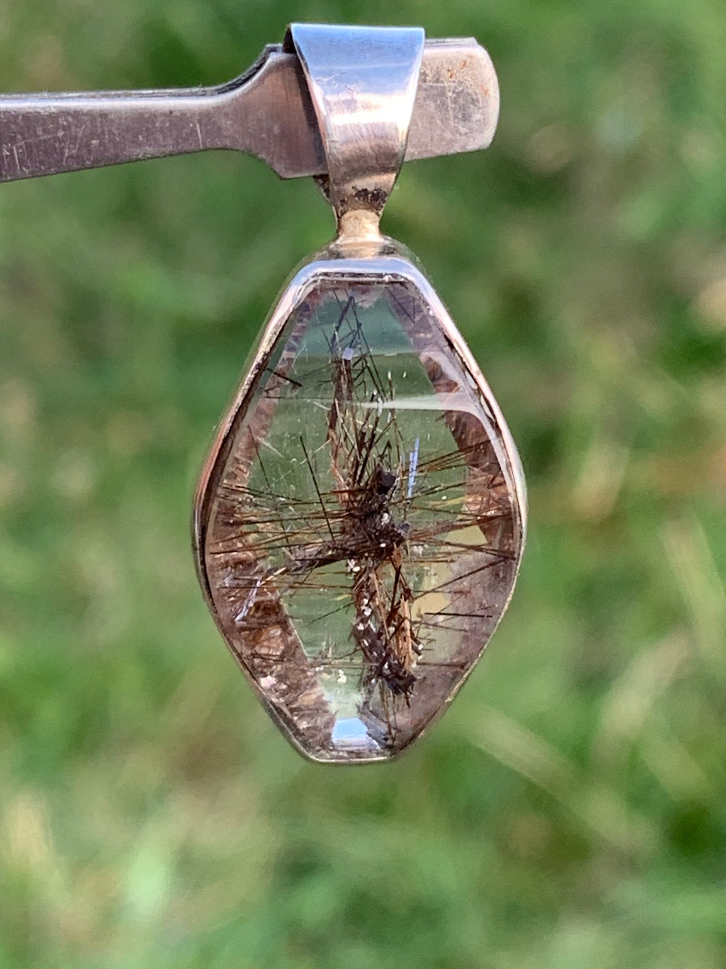Rock crystal (quartz), with tourmaline inclusions! Silver pendant, 38 mm high x 16 x 8 - 8.3 grams. Sold with an adjustable black cord!