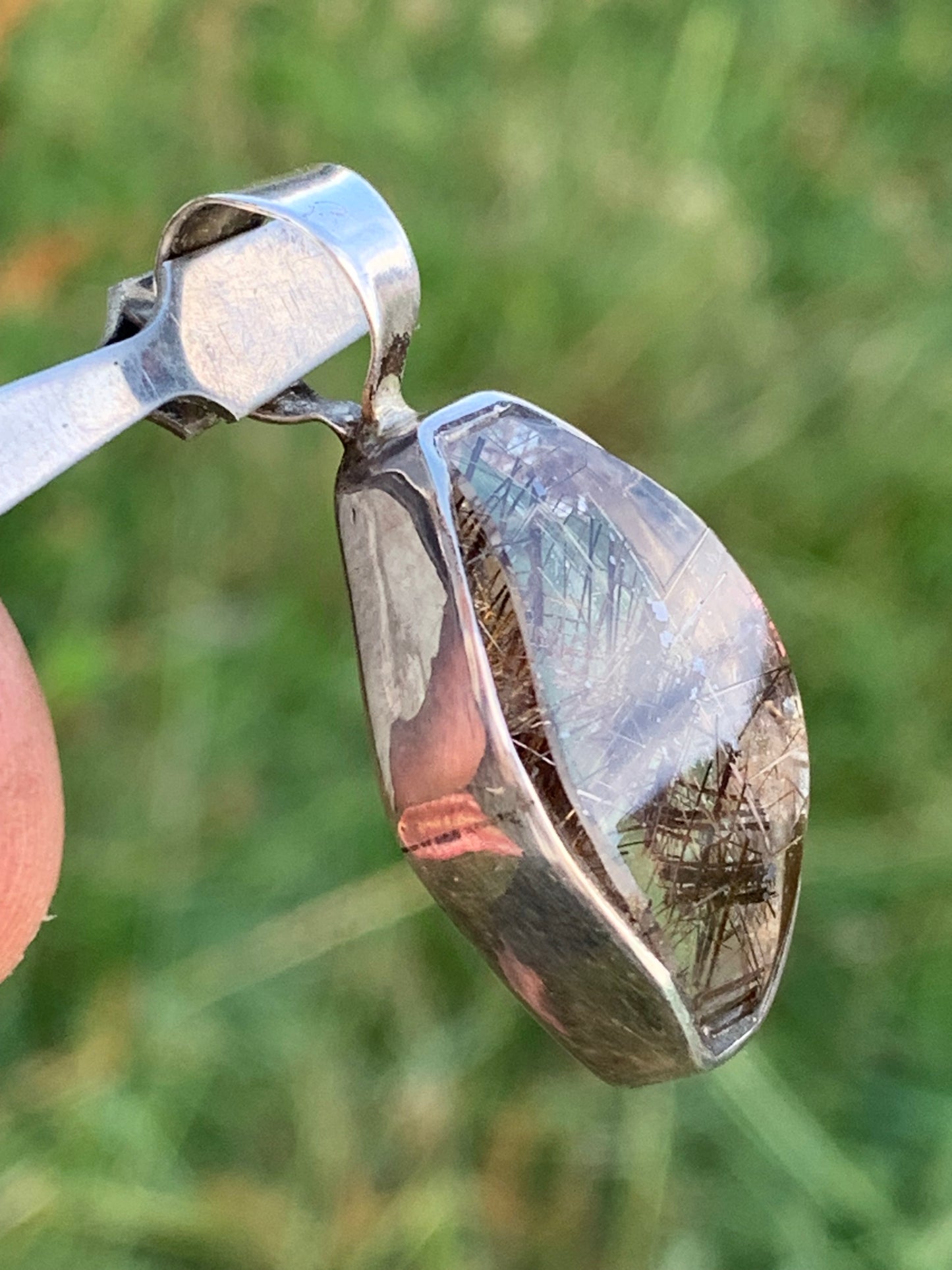 Rock crystal (quartz), with tourmaline inclusions! Silver pendant, 38 mm high x 16 x 8 - 8.3 grams. Sold with an adjustable black cord!