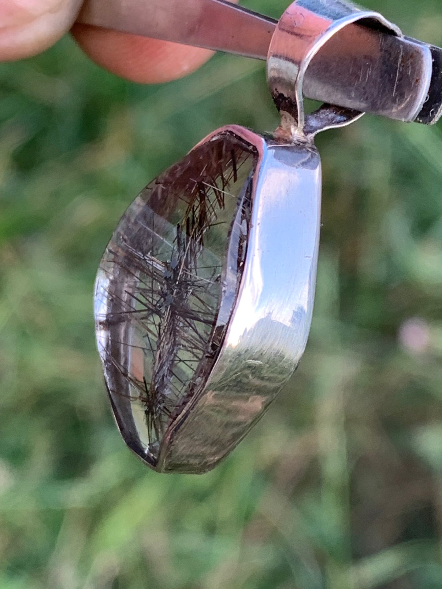 Rock crystal (quartz), with tourmaline inclusions! Silver pendant, 38 mm high x 16 x 8 - 8.3 grams. Sold with an adjustable black cord!
