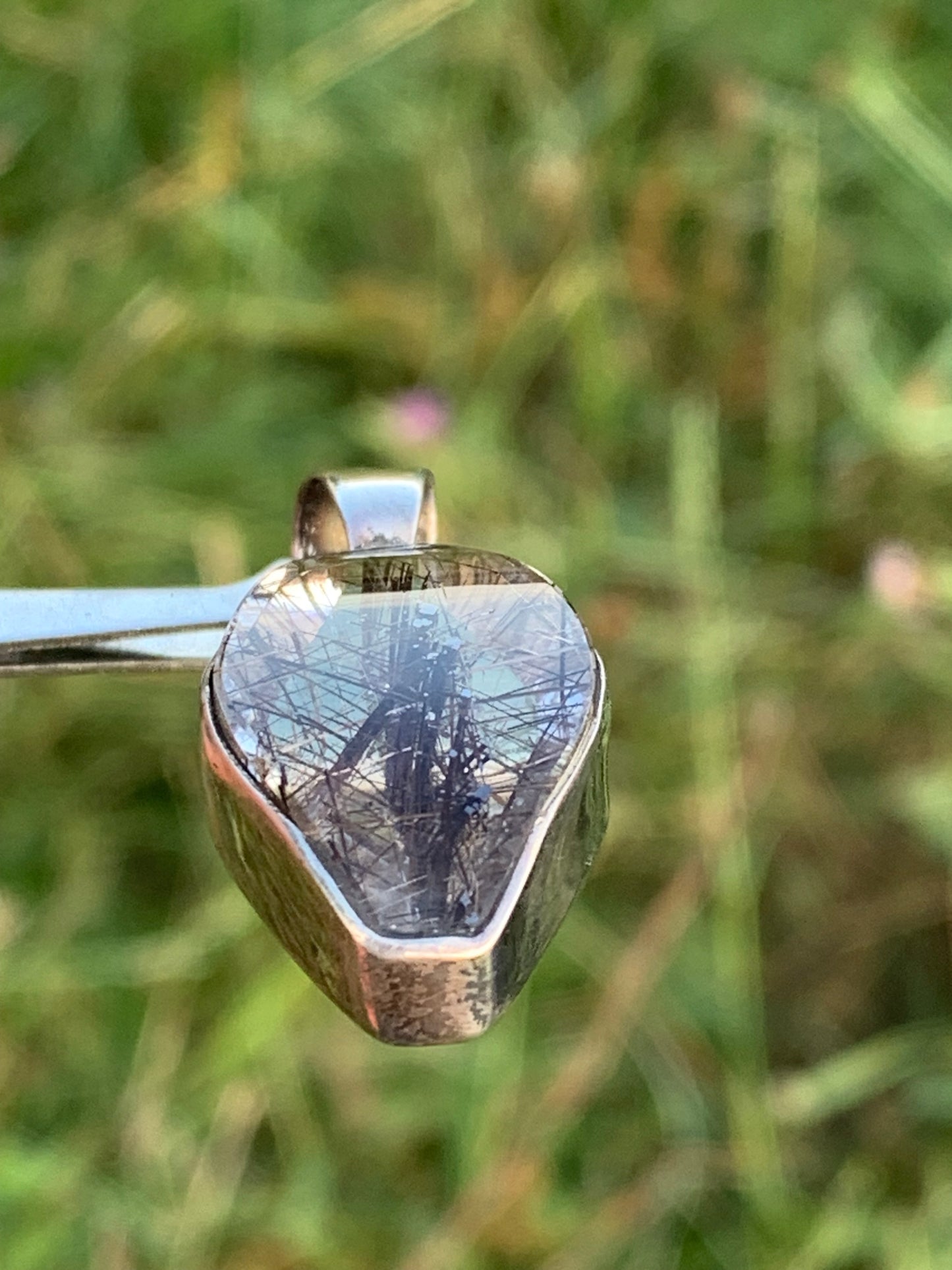 Rock crystal (quartz), with tourmaline inclusions! Silver pendant, 38 mm high x 16 x 8 - 8.3 grams. Sold with an adjustable black cord!