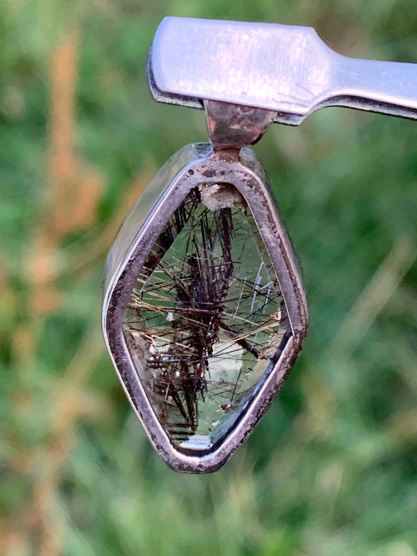 Rock crystal (quartz), with tourmaline inclusions! Silver pendant, 38 mm high x 16 x 8 - 8.3 grams. Sold with an adjustable black cord!