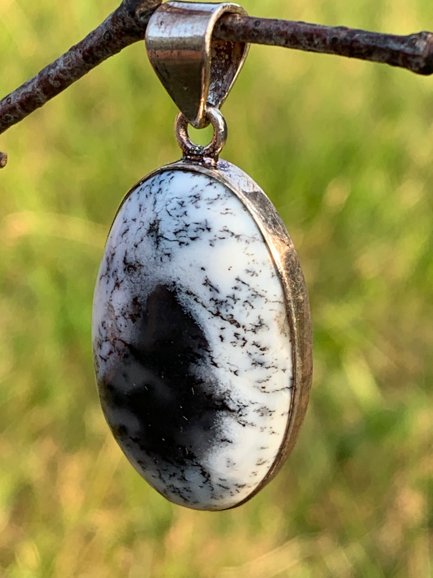 Detritic or dentric opal, silver-set pendant of 42mm x21 x9. Sold with adjustable black cord, ready to wear!