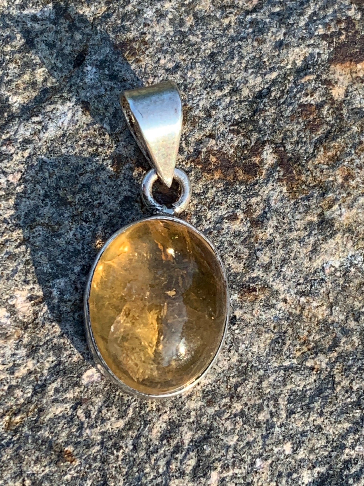 Citrine, silver medallion 30mm high x 14 x 8. Sold with adjustable cord, ready to wear!