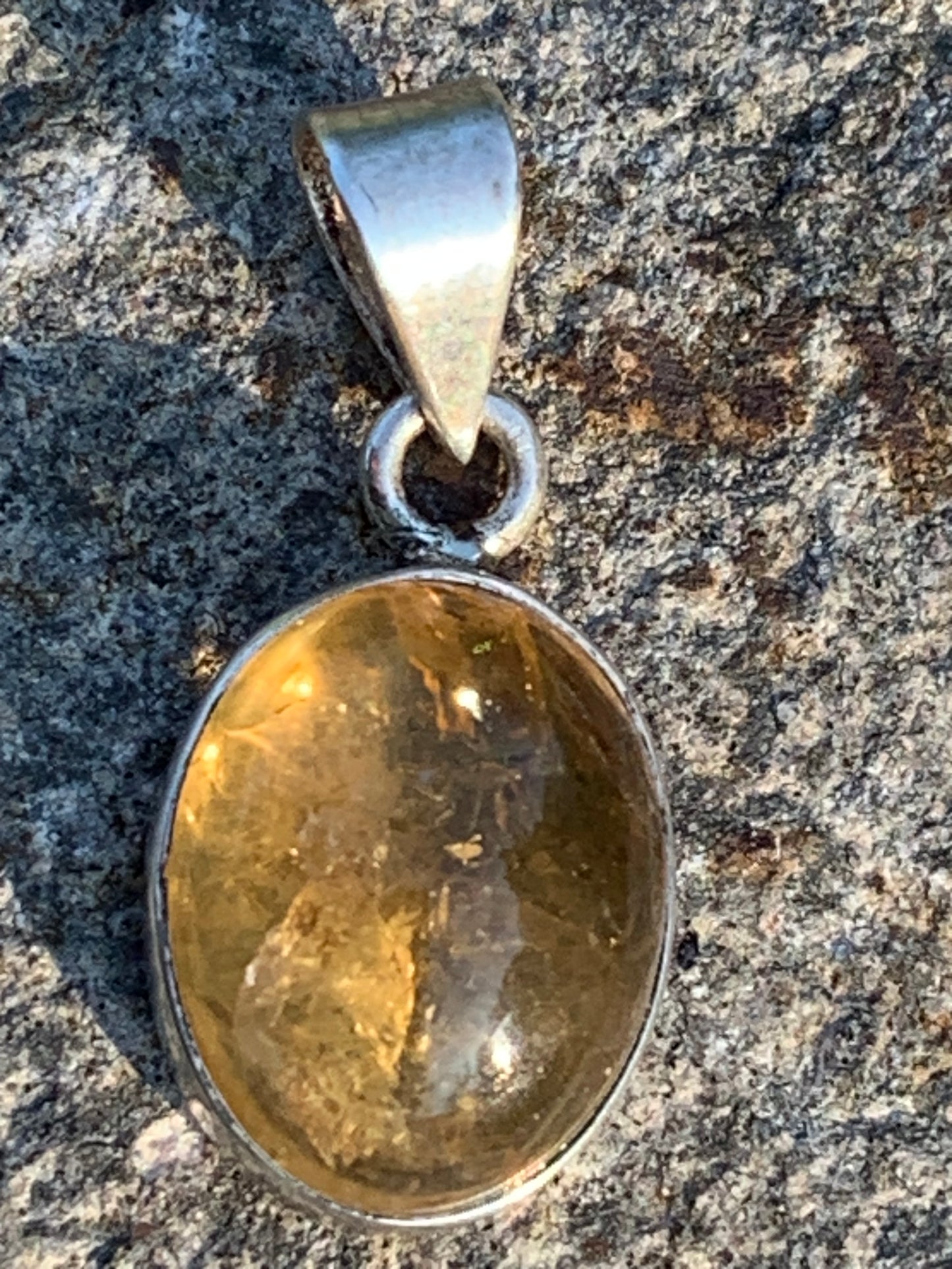 Citrine, silver medallion 30mm high x 14 x 8. Sold with adjustable cord, ready to wear!