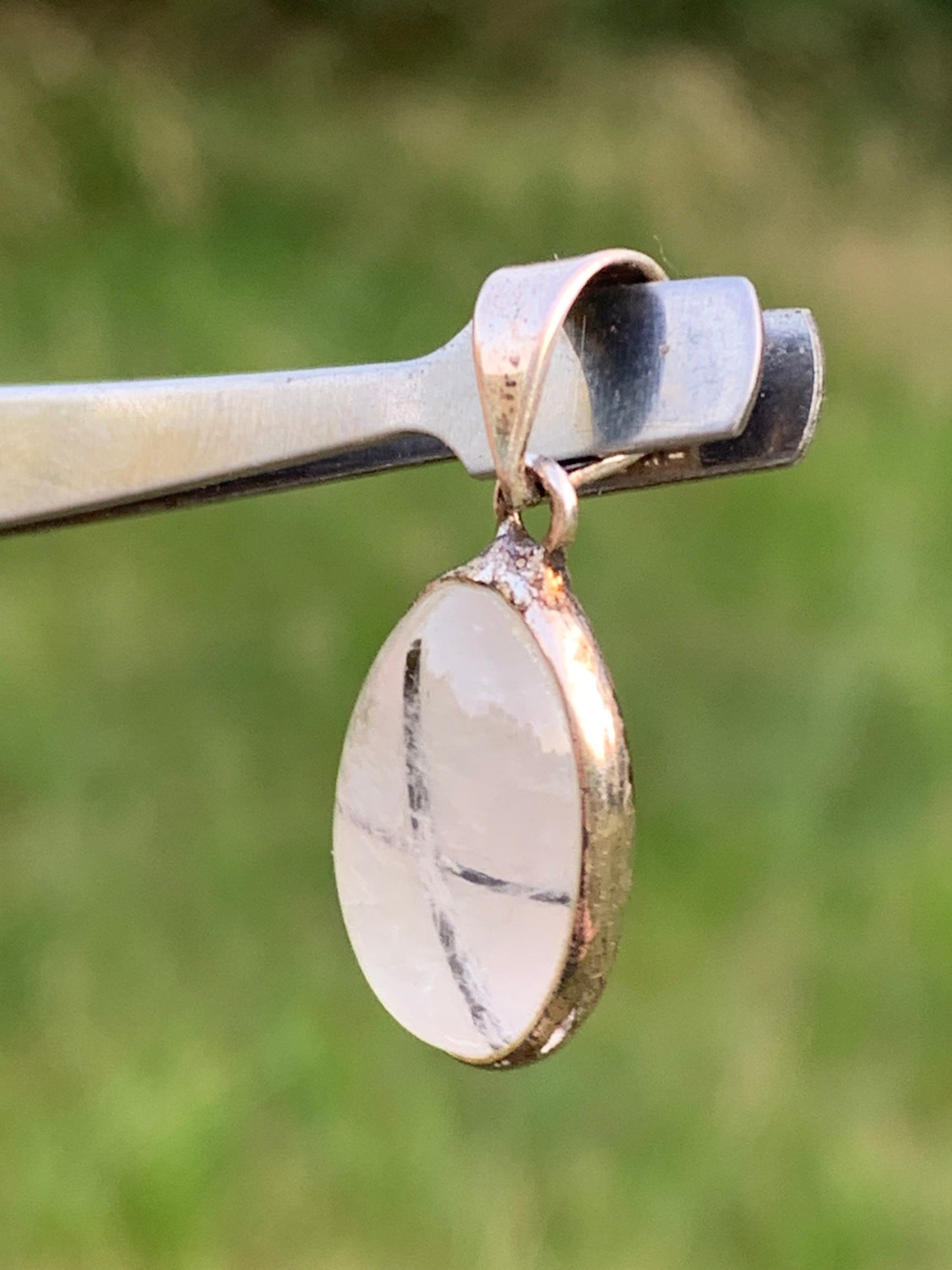 Rock crystal/quartz with black tourmaline inclusions! Silver pendant, 28mm high x13 x7. Sold with an adjustable black cord!