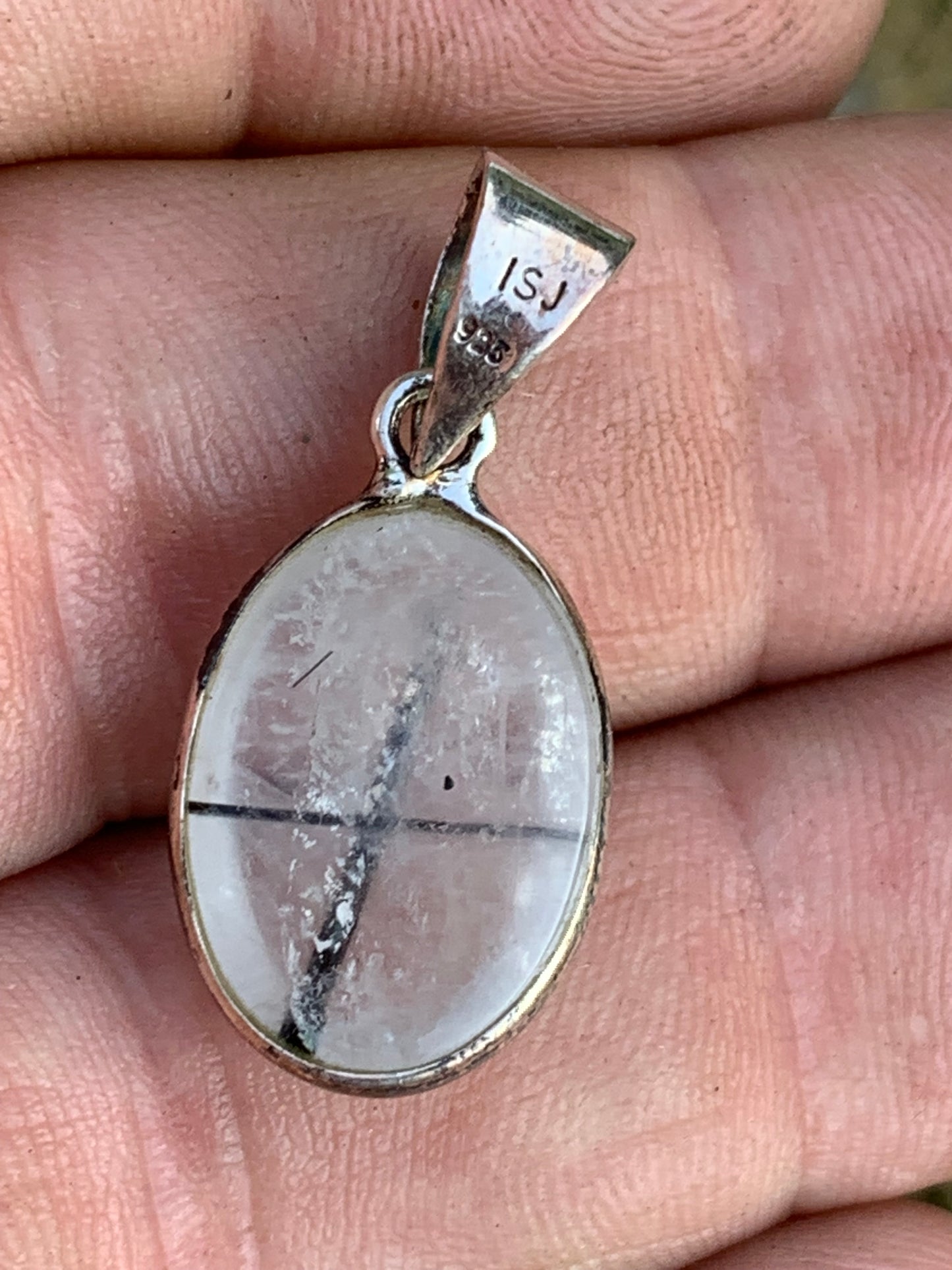 Rock crystal/quartz with black tourmaline inclusions! Silver pendant, 28mm high x13 x7. Sold with an adjustable black cord!
