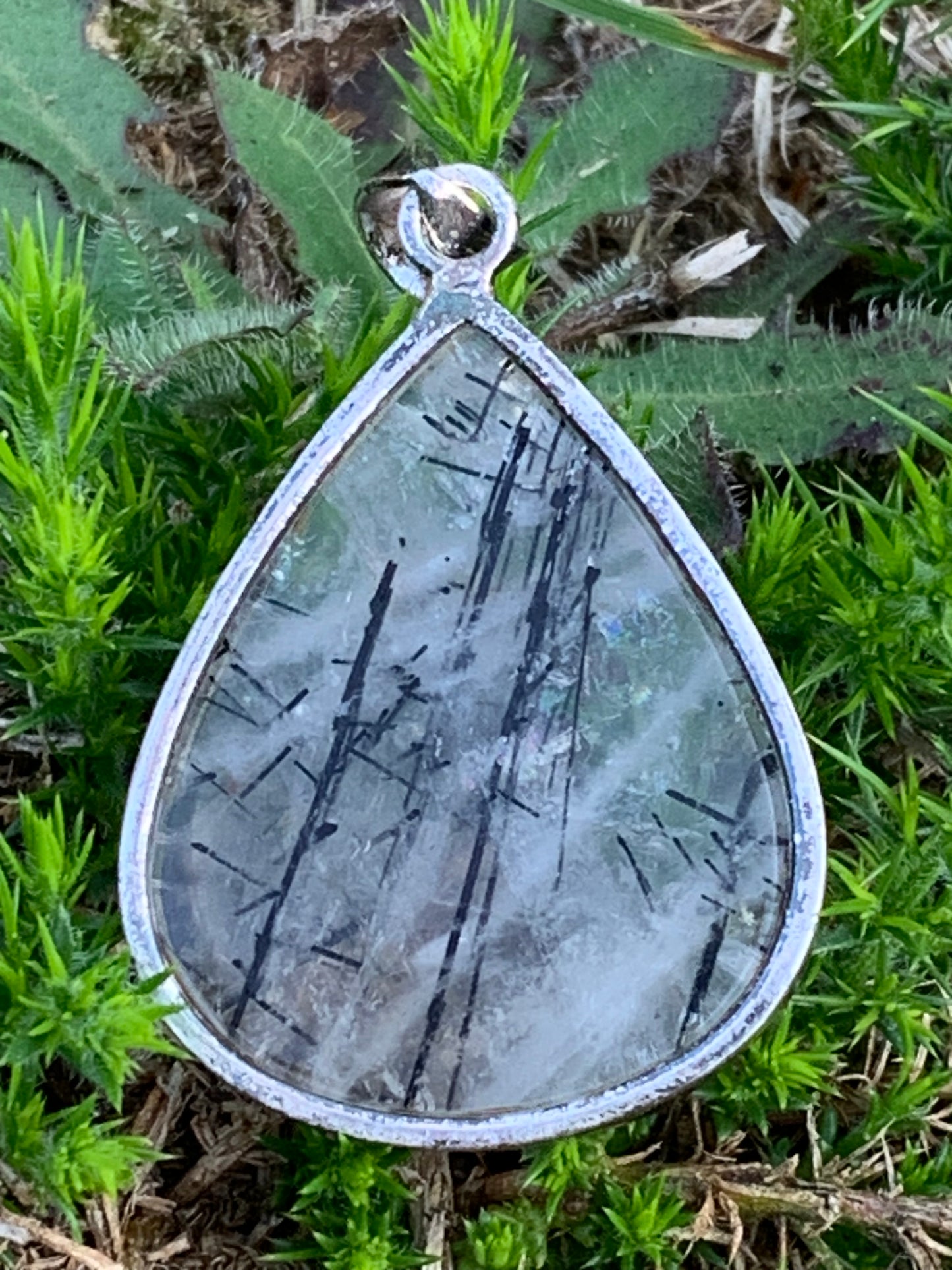 Rock crystal/quartz with black tourmaline inclusions! Silver pendant, 48mm high x30 x7. Sold with adjustable black cord!