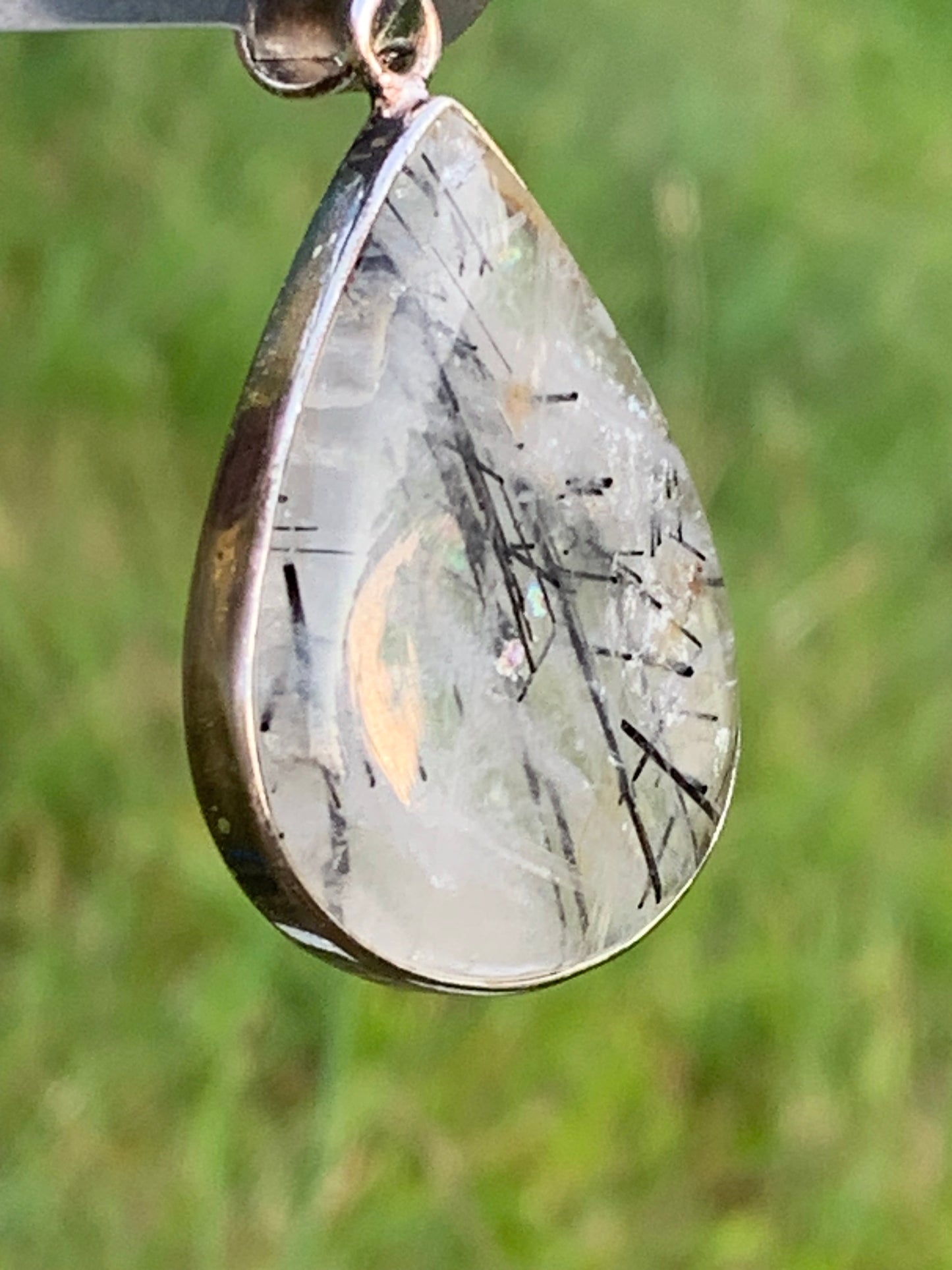 Rock crystal/quartz with black tourmaline inclusions! Silver pendant, 48mm high x30 x7. Sold with adjustable black cord!