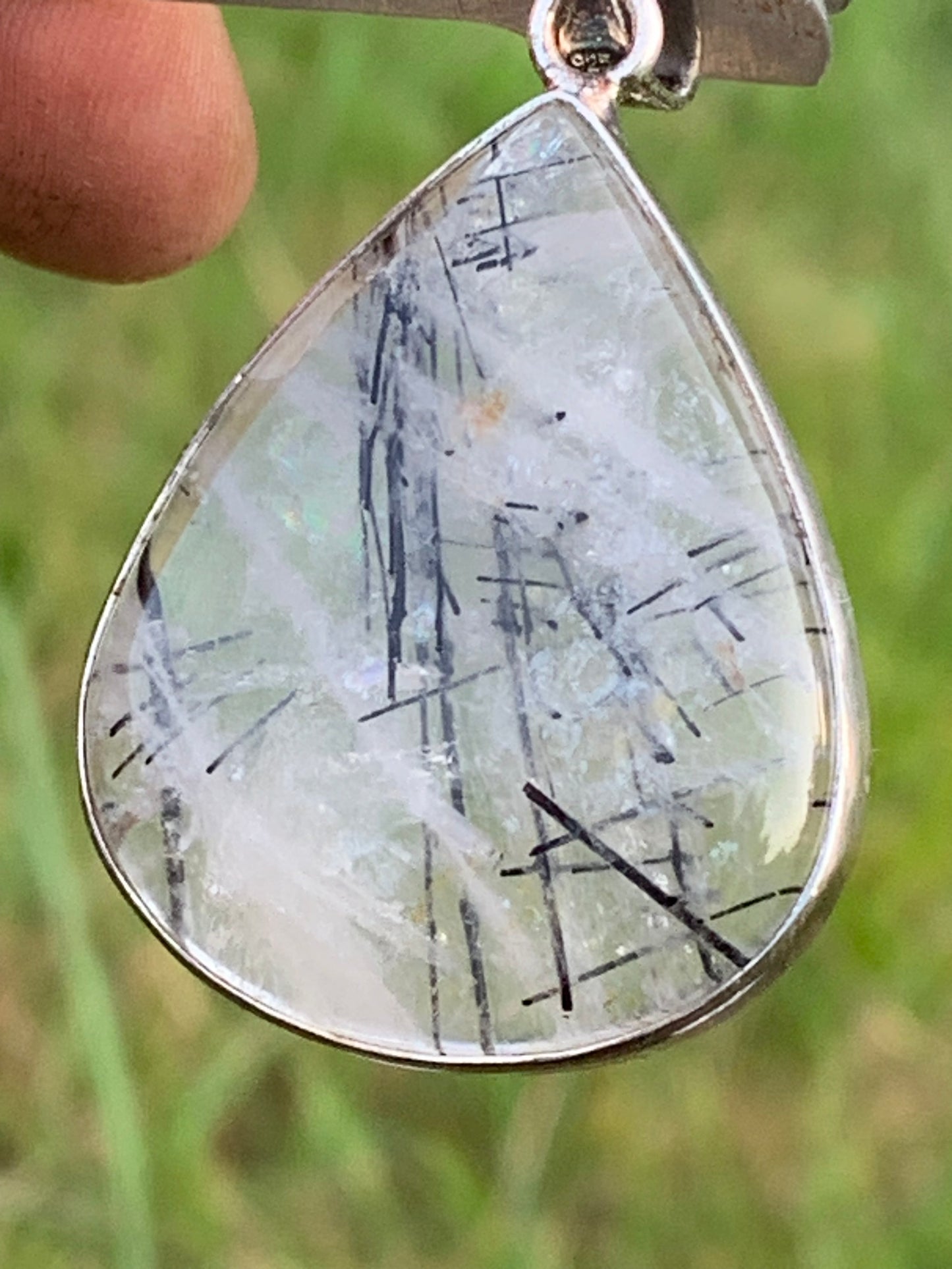 Rock crystal/quartz with black tourmaline inclusions! Silver pendant, 48mm high x30 x7. Sold with adjustable black cord!