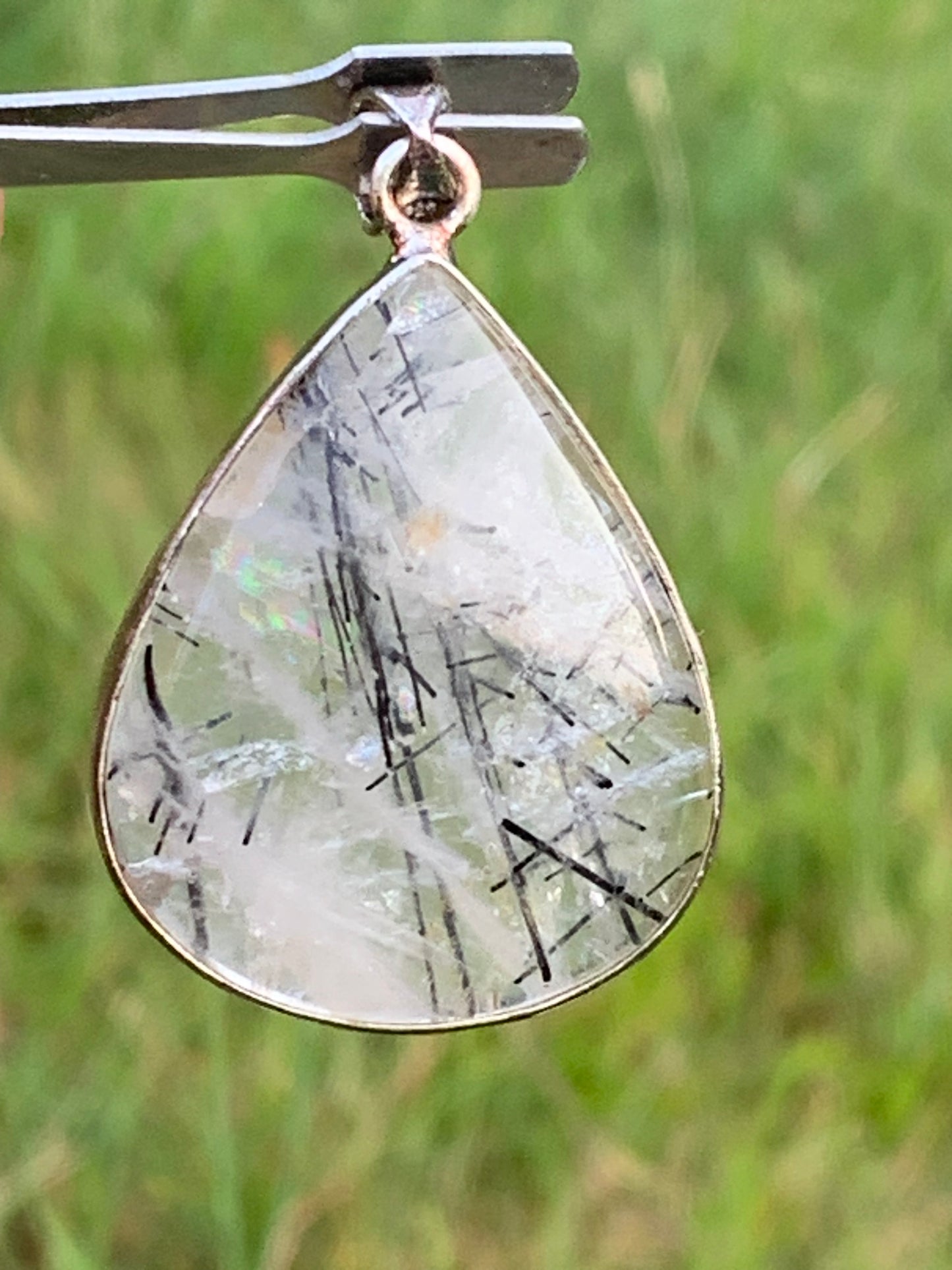 Rock crystal/quartz with black tourmaline inclusions! Silver pendant, 48mm high x30 x7. Sold with adjustable black cord!