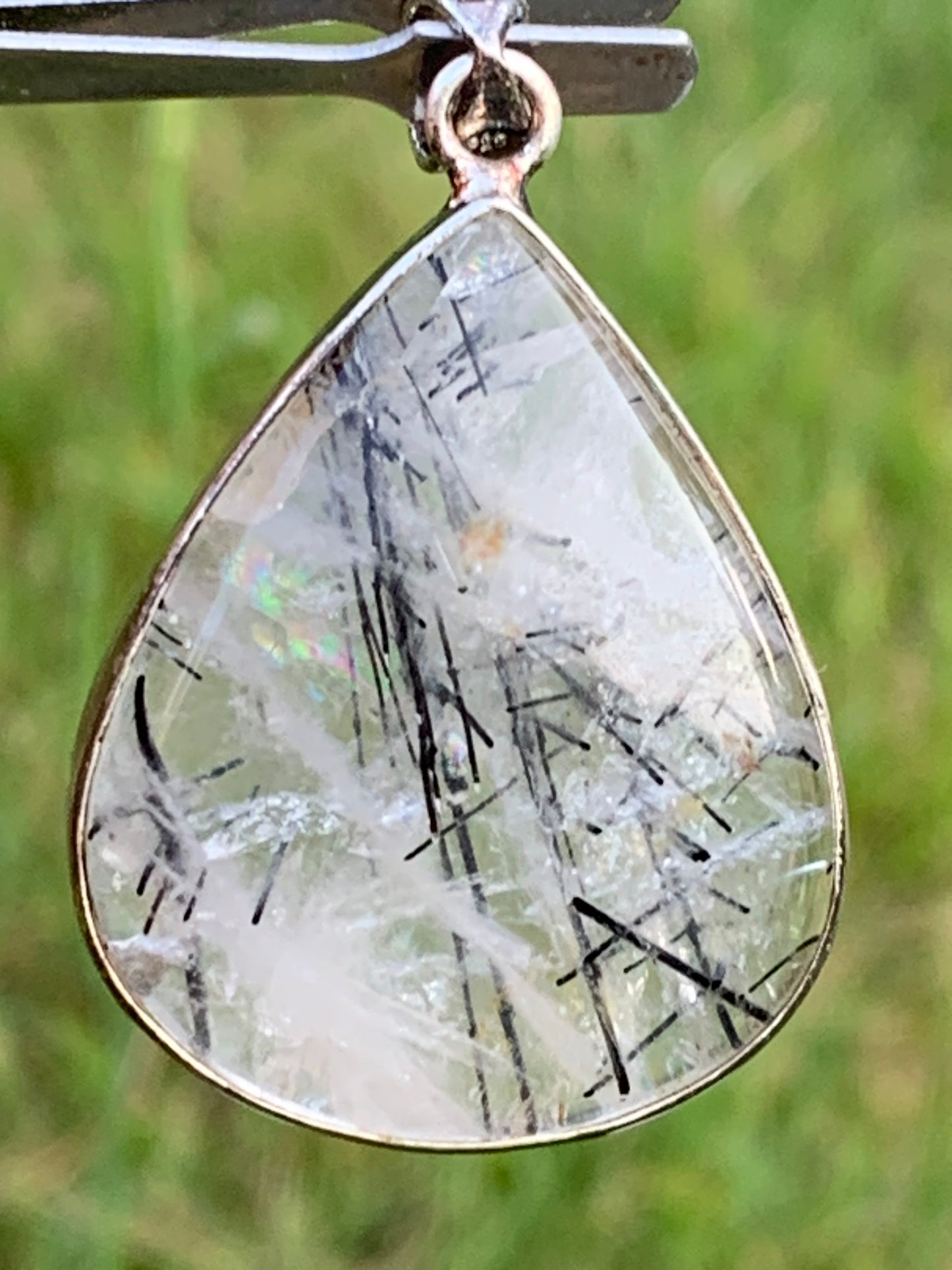 Rock crystal/quartz with black tourmaline inclusions! Silver pendant, 48mm high x30 x7. Sold with adjustable black cord!
