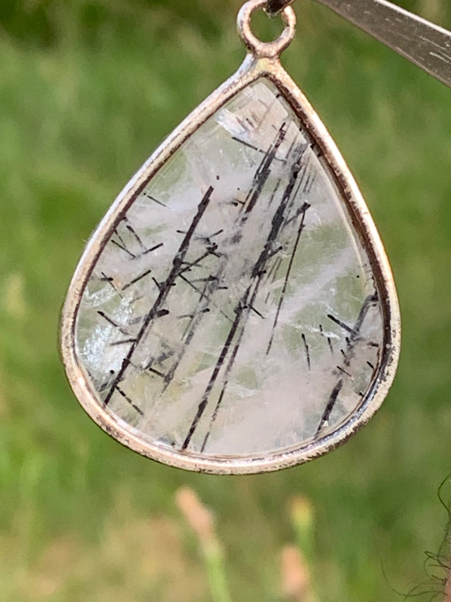 Rock crystal/quartz with black tourmaline inclusions! Silver pendant, 48mm high x30 x7. Sold with adjustable black cord!