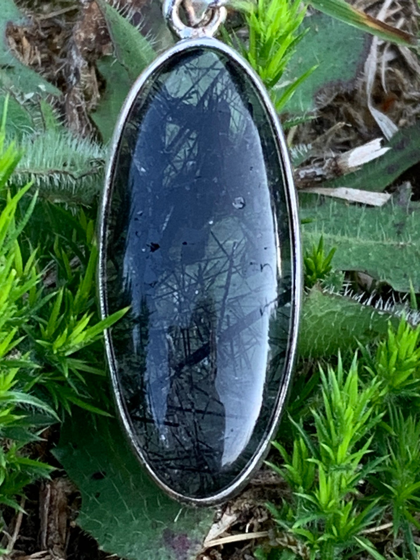 Rock crystal/quartz with black tourmaline inclusions! Silver pendant, 45mm high x15 x8. Sold with adjustable black cord!