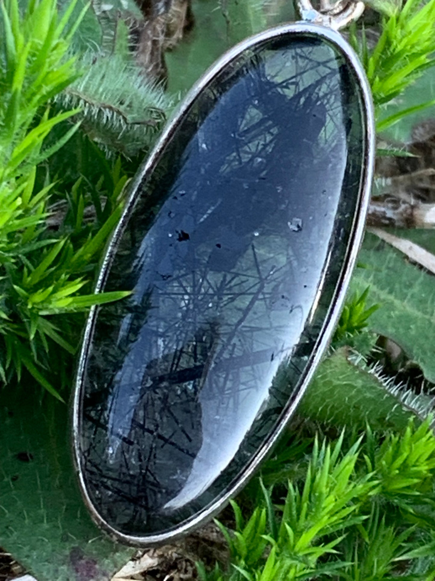 Rock crystal/quartz with black tourmaline inclusions! Silver pendant, 45mm high x15 x8. Sold with adjustable black cord!