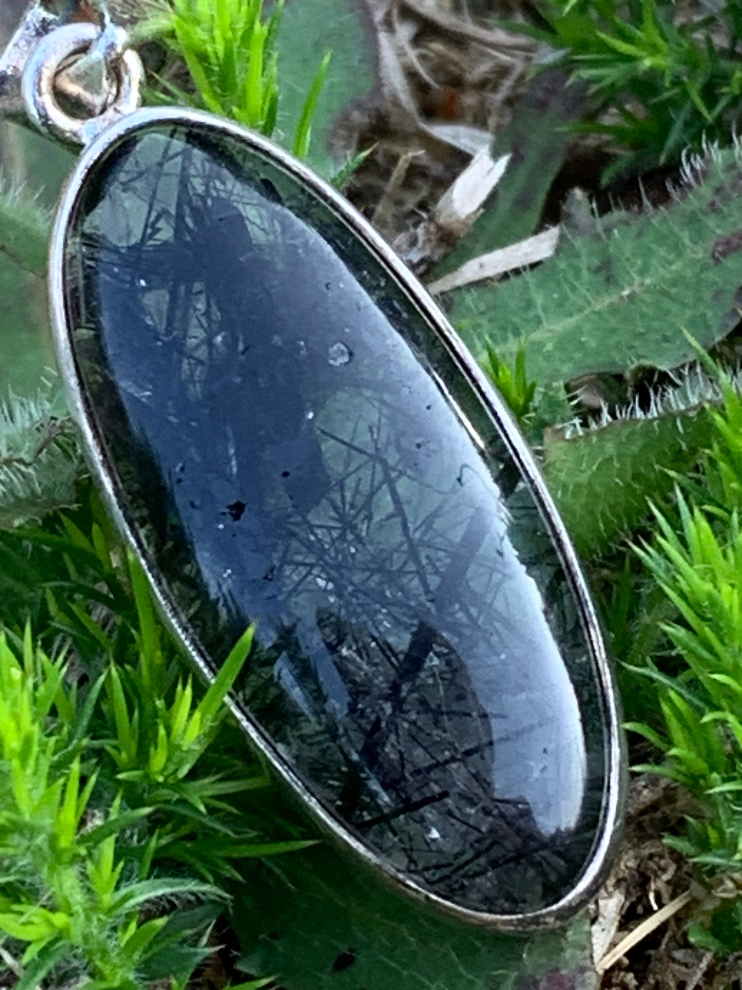 Rock crystal/quartz with black tourmaline inclusions! Silver pendant, 45mm high x15 x8. Sold with adjustable black cord!
