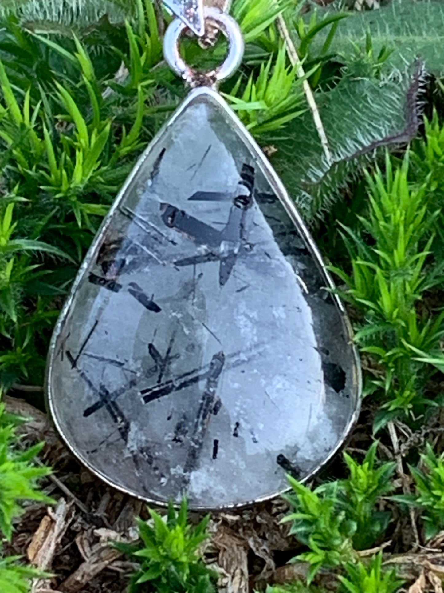 Rock crystal/quartz with black tourmaline inclusions! Silver pendant, 38mm high x21 x7. Sold with adjustable black cord!