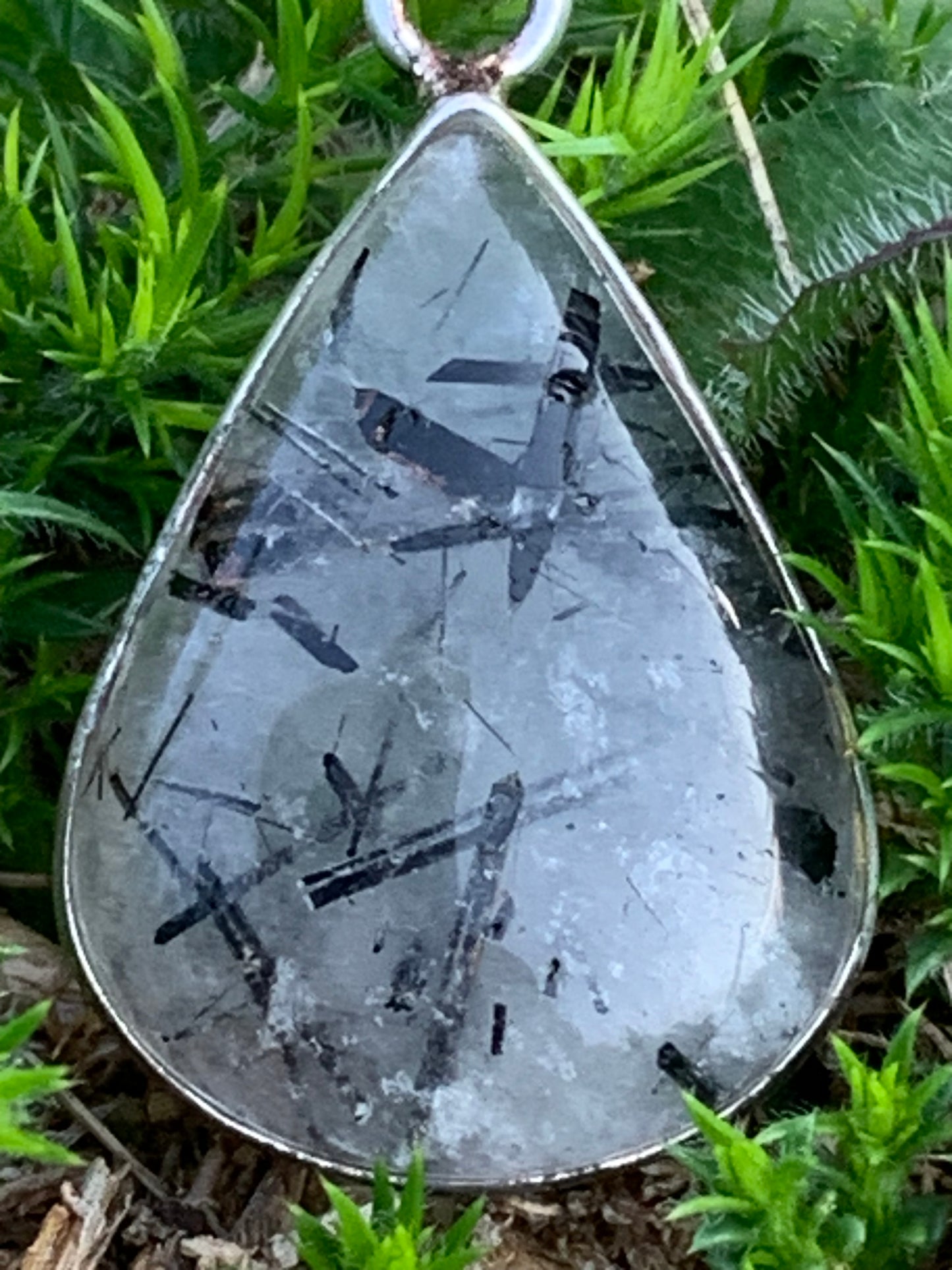 Rock crystal/quartz with black tourmaline inclusions! Silver pendant, 38mm high x21 x7. Sold with adjustable black cord!
