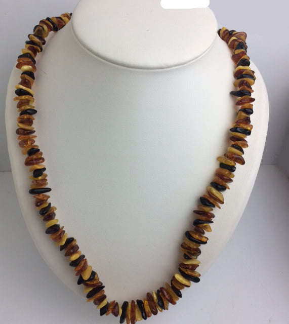 Amber, free-form beads measuring 10 to 20 millimeters, sold as a bracelet or necklace of approximately 70 centimeters. Amber screw clasp system. AA to AAA quality, superb beads, lightweight and incredibly soft!