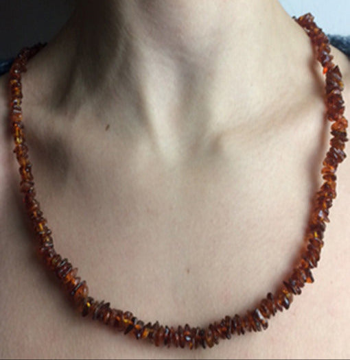 Amber, free-form beads measuring 10 to 15 millimeters, sold as a bracelet or necklace of approximately 65 centimeters. Amber screw clasp system. AA to AAA quality, superb beads, lightweight and incredibly soft!