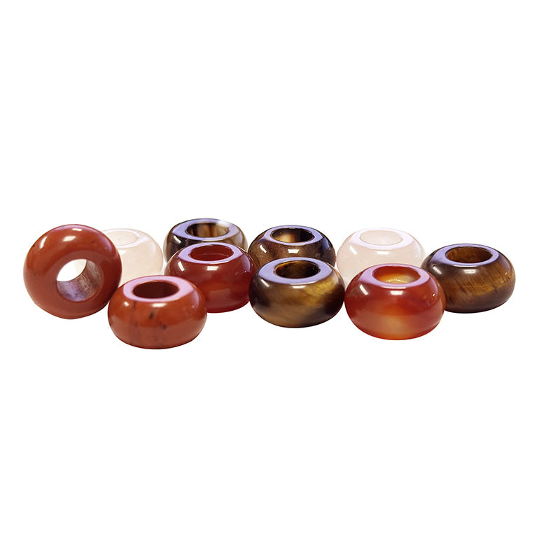 Perles en pierres naturelles de 14 millimètres de diamètre avec un trou d'environ 6 mm. Parfait pour vos projets de bijoux, macramé. Disponible en Sodalite, Œil de Tigre, Quartz Rose, Aventurine, Onyx, Cornaline ou bien en assortiment. Vendu par 10 !