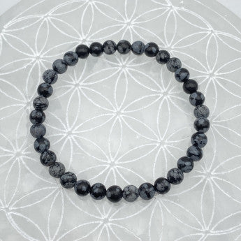 Obsidienne Flocon de Neige/ Mouchetée, perles rondes de 6 ou 8 mm. Vendu en fil de perle 38/39 cm, en bracelet de 17 à 21cm, en collier de 45 ou sautoir de 60cm. Qualité AA à AAA !