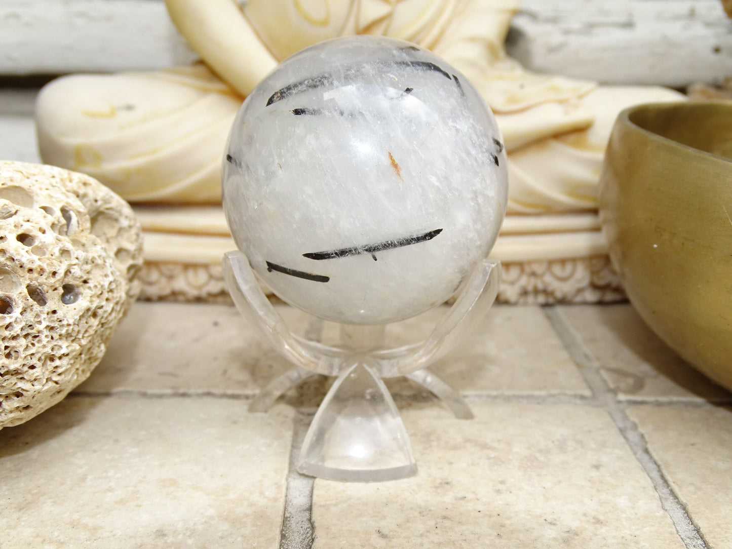 Crystal/Quartz spheres with black tourmaline inclusions, 46 and 52 millimeters - 136 and 196 grams. A surprising stone!