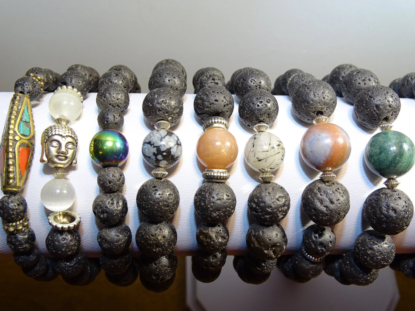 Lava Stone Bracelet Collection... Made from 8mm lava beads and a semi-precious stone bead. Available in lengths from 17 to 21 centimeters. Handmade by Gem & Zen!