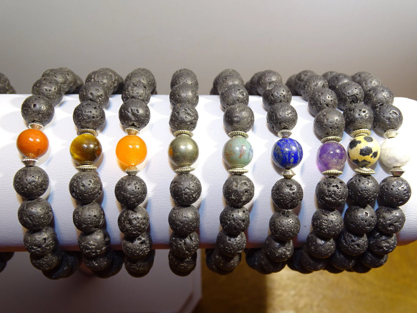 Lava Stone Bracelet Collection... Made from 8mm lava beads and a semi-precious stone bead. Available in lengths from 17 to 21 centimeters. Handmade by Gem & Zen!