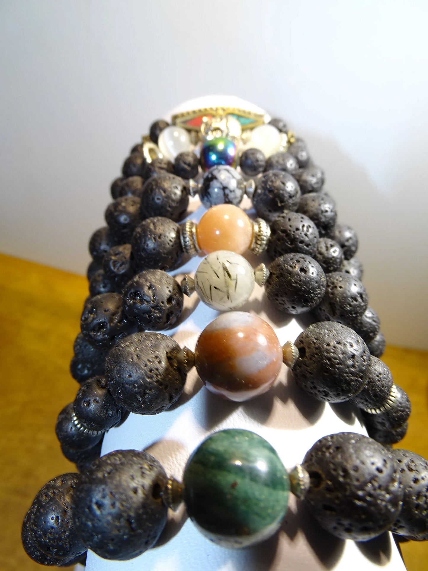 Lava Stone Bracelet Collection... Made from 8mm lava beads and a semi-precious stone bead. Available in lengths from 17 to 21 centimeters. Handmade by Gem & Zen!