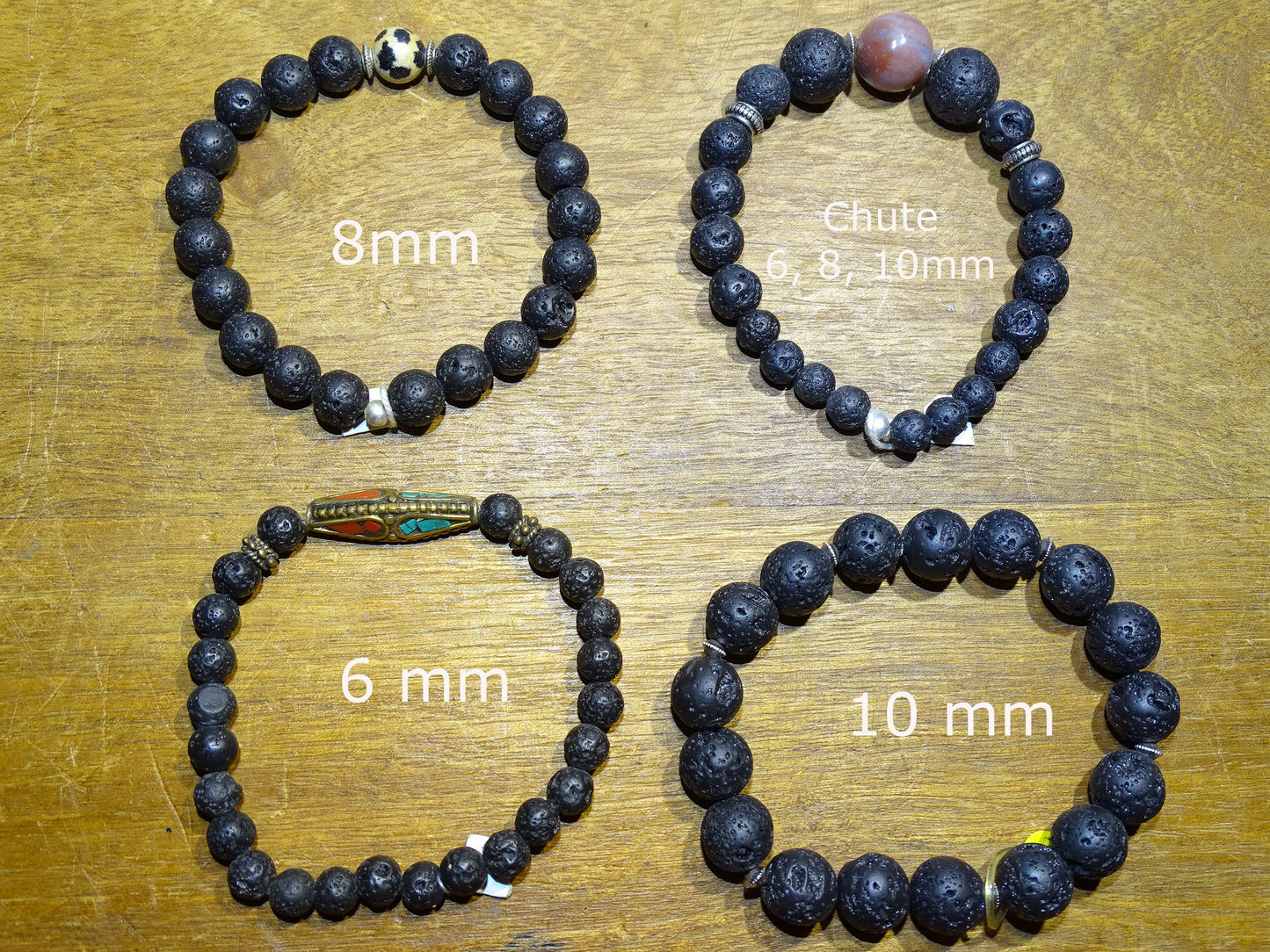 Lava Stone Bracelet Collection... Made from 8mm lava beads and a semi-precious stone bead. Available in lengths from 17 to 21 centimeters. Handmade by Gem & Zen!