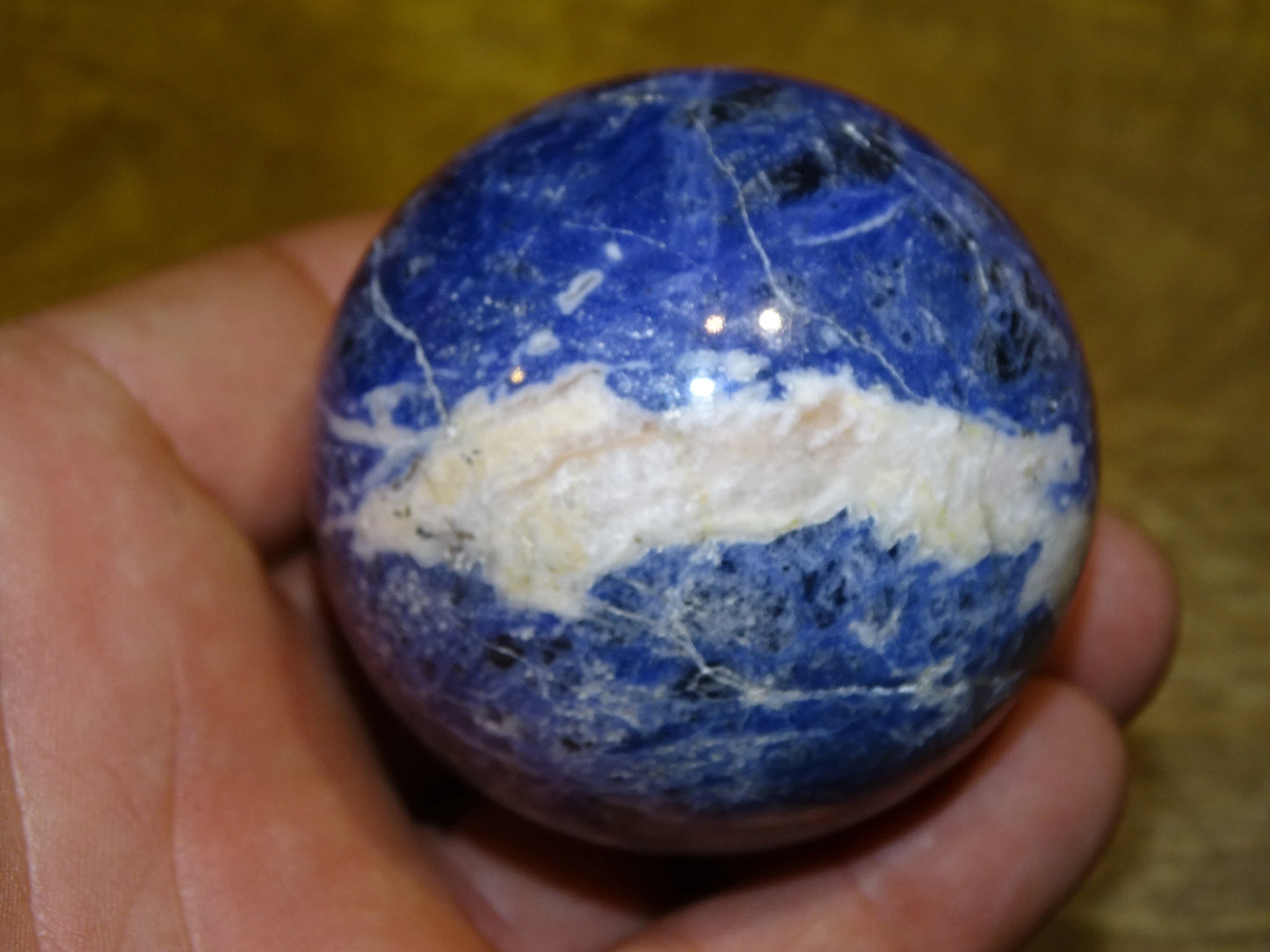 Sodalite sphere weighing 320 grams and measuring 58 millimeters. Perfect for a collection or exhibition!