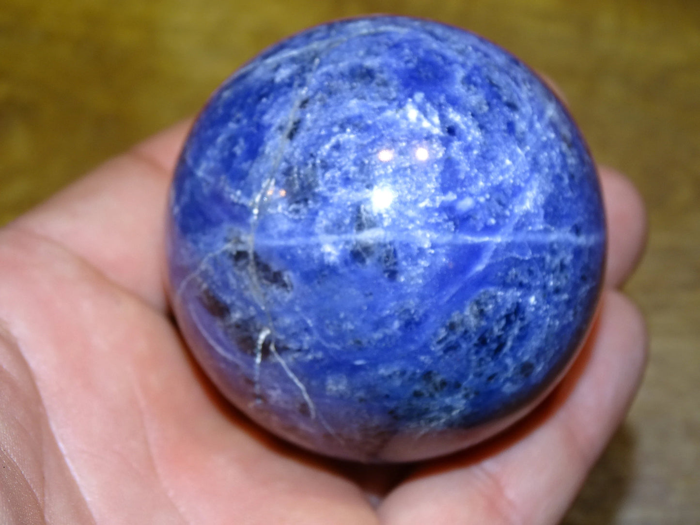 Sodalite sphere weighing 320 grams and measuring 58 millimeters. Perfect for a collection or exhibition!