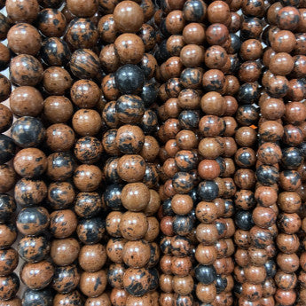 Obsidienne Acajou/ Mahogany, perles rondes de 6 ou 8 mm. Vendu en fil de perle 38/39 cm, en bracelet de 17 à 21cm, en collier de 45 ou sautoir de 60cm. Qualité AA à AAA, superbes perles !