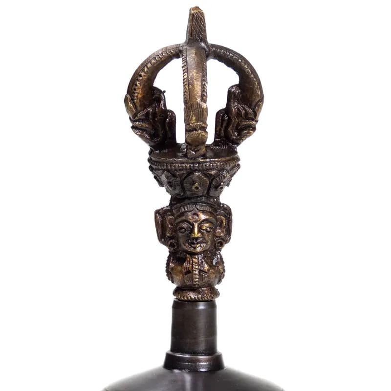 Dorje and bell made of high-quality plain bronze. The sound is exceptionally clear and lasts twice as long as a brass bell. This bell can also be turned with a stick, much like a singing bowl.