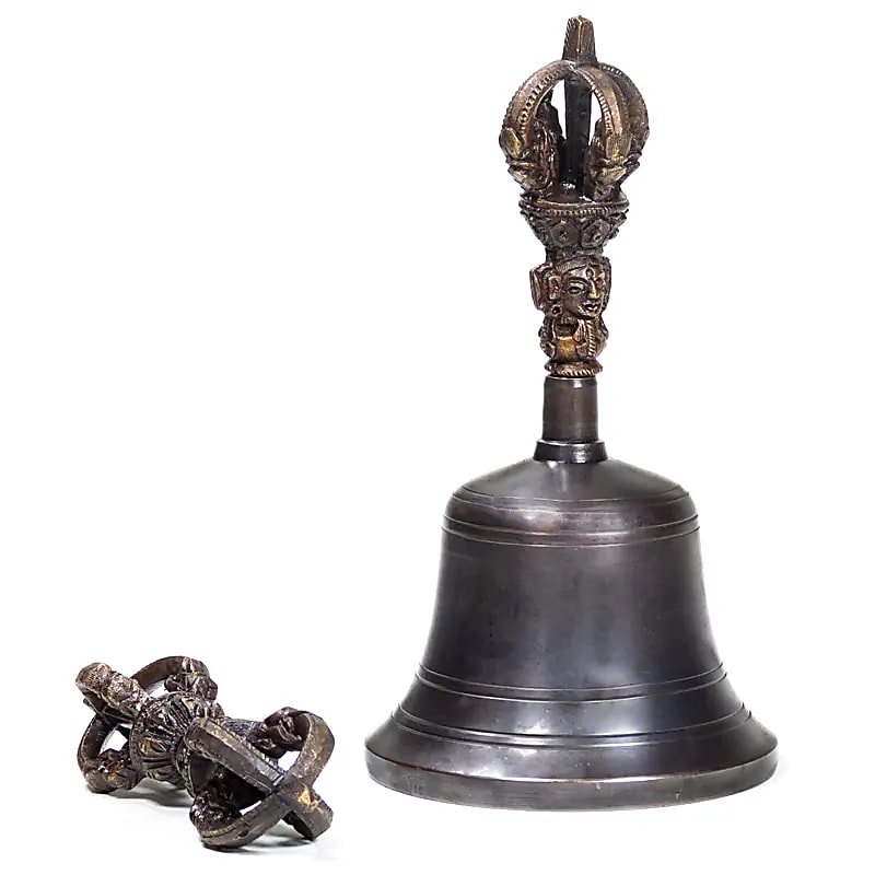 Dorje and bell made of high-quality plain bronze. The sound is exceptionally clear and lasts twice as long as a brass bell. This bell can also be turned with a stick, much like a singing bowl.