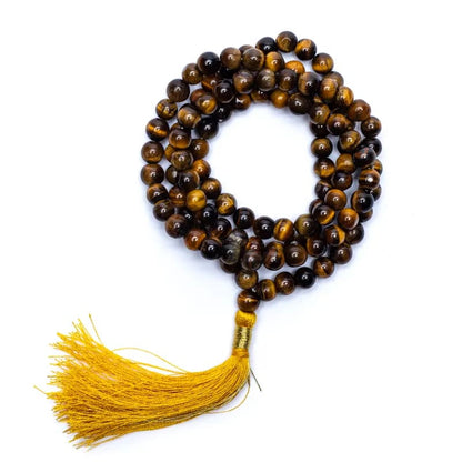 Mala en Oeil du tigre, de 108 perles de 6 ou 8 millimètres. Taille de 65 à 85 centimètres de longueur environ. Qualité AA à AAA, superbe pièce avec pochette de rangement offerte. Fait en Inde !