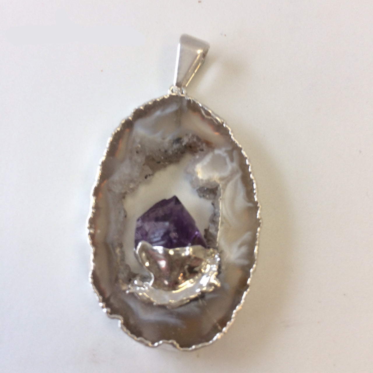 Amethyst, 'mini-geode' pendant called 'géodinhos', 45mm high x 24 wide x 7 thick. Sold with adjustable black cord!